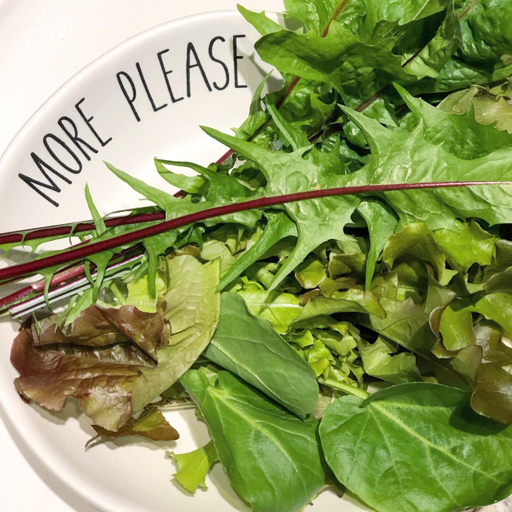 Plate of greens with dandelion